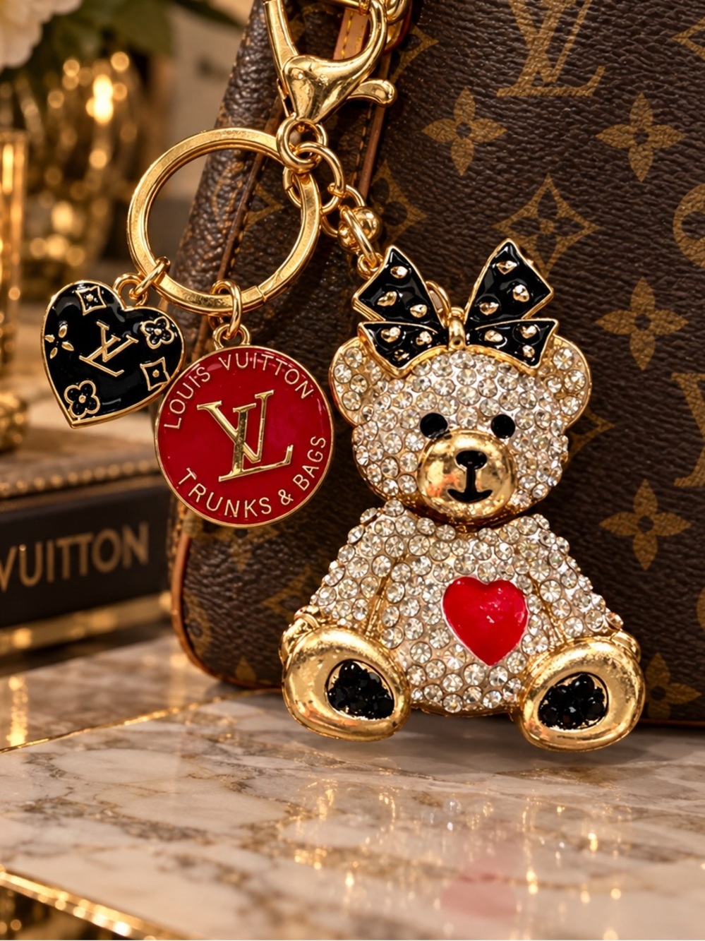 2 Louis Vuitton zipper pulls